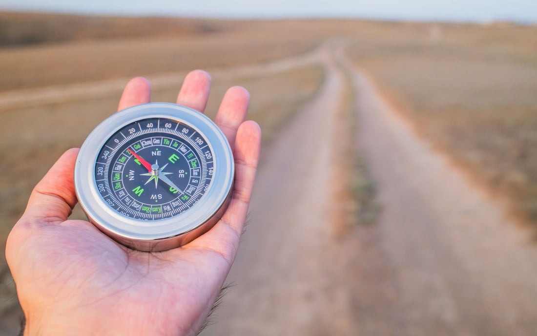 Compass on a map before an autumn hike